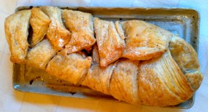 Dice 3 small organic Gala apples and 2 organic figs. Melt about 1 tbsp. of organic coconut oil in pan over medium heat. Saute fruit adding about 2 tsp. each organic cinnamon and coconut sugar. Cook until soft, about 8 mins. Add 1/3 cup sliced almonds and cool. Meanwhile defrost package of puff pastry. Roll into about 9” x 12” rectangle. Place filling in centre and roll or braid. To braid, slice dough away from filling on both sides of pastry then alternate strips to cover filling. Brush pastry with melted coconut oil and bake in 350° oven until pastry is puffed and golden, about 20 mins.